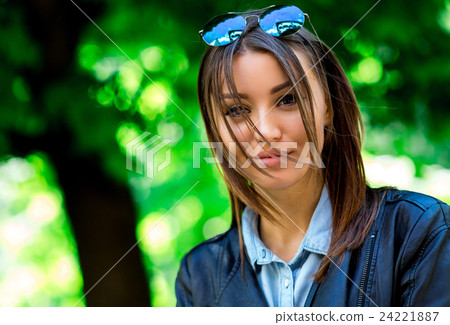 Portrait face of an young fashion brunette model Portrait face of an young fashion brunette model 24221887
