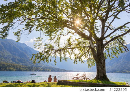 Couple enjoying beautiful nature around lake Couple enjoying beautiful nature around lake 24222295