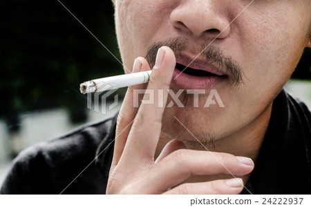 asian finger man keep cigaret 24222937