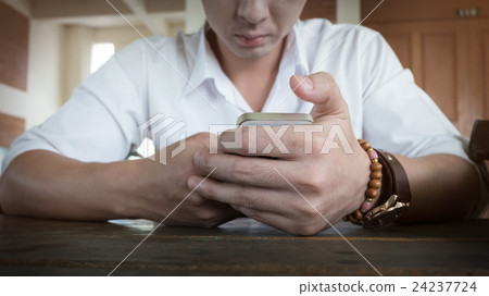 businessman using a mobile phone with texting businessman using a mobile phone with texting 24237724