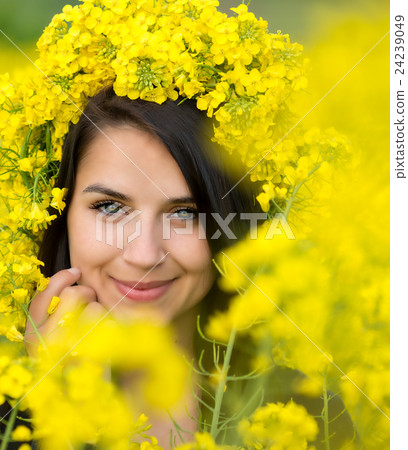 Portrait of young woman in the rape, colza field Portrait of young woman in the rape, colza field 24239049