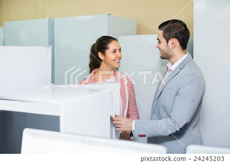 Couple buying domestic refrigerator 24245203