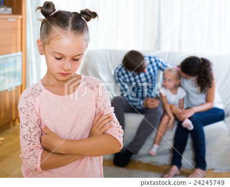 girl sad because of jealous younger sister to parents 24245749