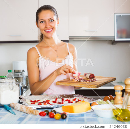 Woman making tasty Italian pizza 24246088