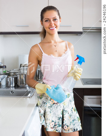 Attractive woman cleaning kitchen . 24246196