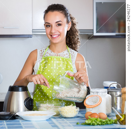 Woman with blender at kitchen. 24246277