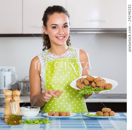brunette with home-made croquettes brunette with home-made croquettes 24246281
