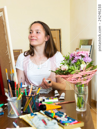 young artist paints a picture 24246288