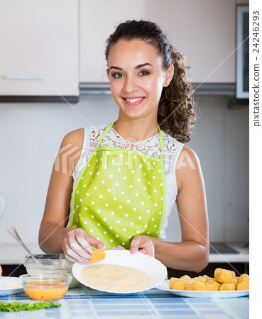 housewife cooking breadcrumbed croquettes housewife cooking breadcrumbed croquettes 24246293