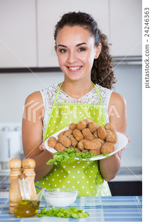 brunette with home-made croquettes brunette with home-made croquettes 24246363
