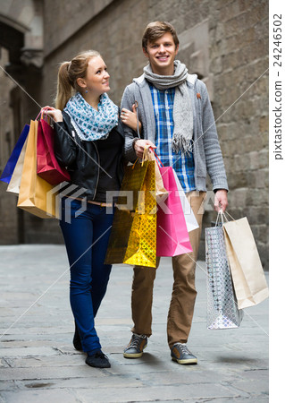 Young adults in shopping tour. 24246502