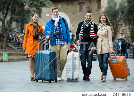 friends walking through city street 24246686