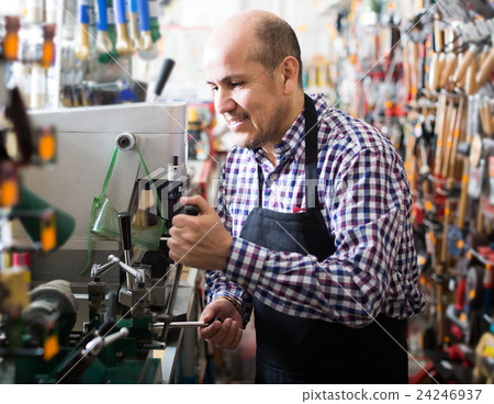 Senior professional with different types of keys in locksmith Senior professional with different types of keys in locksmith 24246937