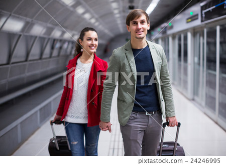 People carrying luggage at metro 24246995
