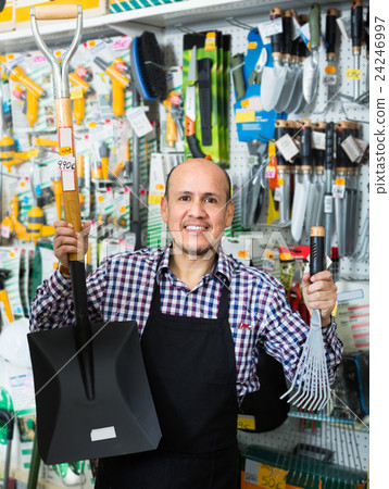 seller smiling at gardening section seller smiling at gardening section 24246997