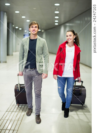 People carrying luggage at metro 24247103