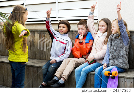 Little kid acting out phrase to friends Little kid acting out phrase to friends 24247593