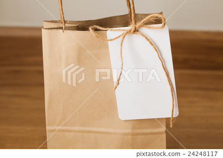 Empty shopping bag with card attached 24248117