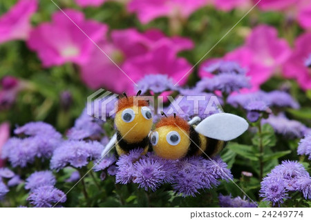 Honey bee's mascot and Ageratum and Petunia sideways Honey bee's mascot and Ageratum and Petunia sideways 24249774