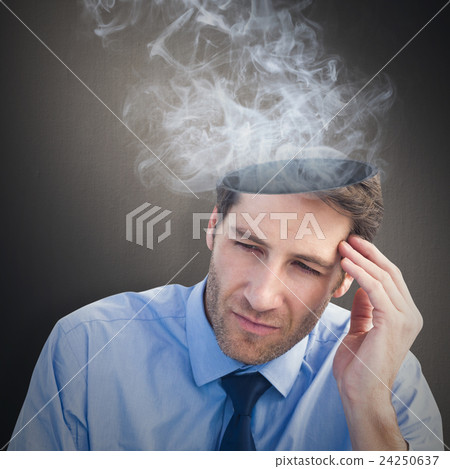 Composite image of stressed businessman holding his head 24250637