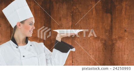 Composite image of woman chef holding a plate Composite image of woman chef holding a plate 24250993