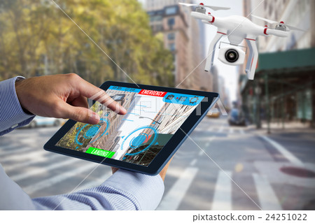 Composite image of man using tablet pc Composite image of man using tablet pc 24251022