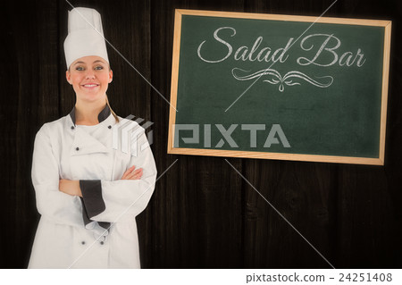 Composite image of friendly woman chef smiling and crossed arms 24251408