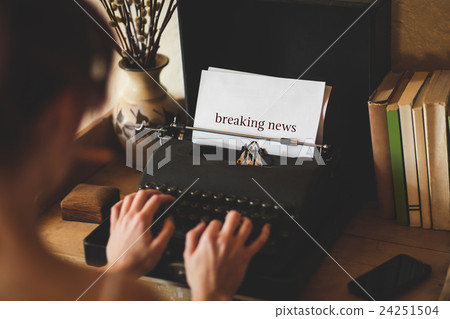 Breaking news against young woman using typewriter 24251504