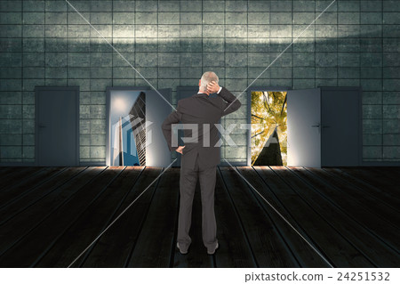 Composite image of rear view of doubtful mature businessman  24251532