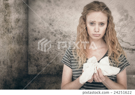 Composite image of sick blonde woman holding paper tissue Composite image of sick blonde woman holding paper tissue 24251622
