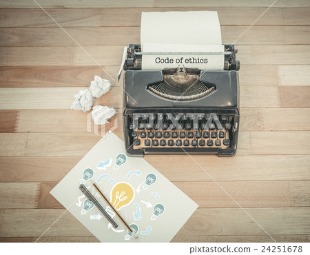Code of ethics against typewriter and paper on table in office Code of ethics against typewriter and paper on table in office 24251678