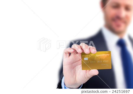 Businessman showing a creditcard Businessman showing a creditcard 24251697
