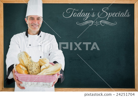 Composite image of chef smiling and holding a bread basket Composite image of chef smiling and holding a bread basket 24251704