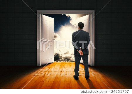 Composite image of rear view of classy businessman posing 24251707