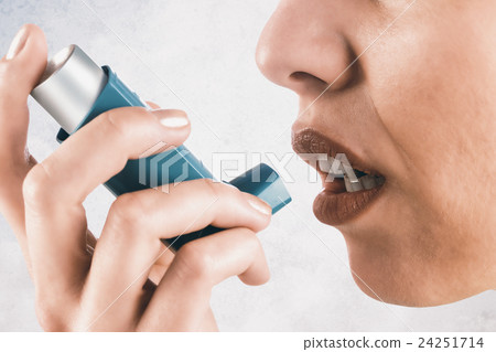 Composite image of close up on an asthmatic woman  24251714