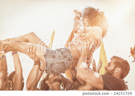 Happy hipster woman crowd surfing 24251729