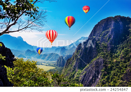 Colourful hot-air balloons flying Colourful hot-air balloons flying 24254847