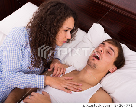 Angry girl tired of loud boyfriend snore 24264771