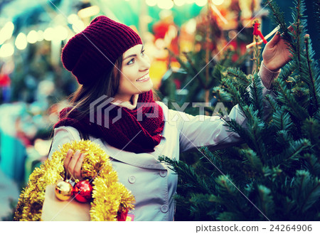 Woman choosing New Year's tree 24264906