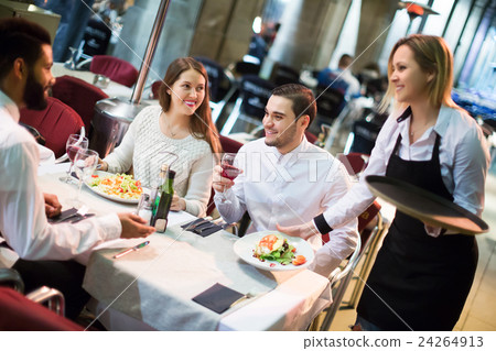 Smiling friends in outdoors restauran Smiling friends in outdoors restauran 24264913
