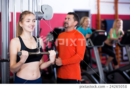 Adult people having strength training in gym 24265058