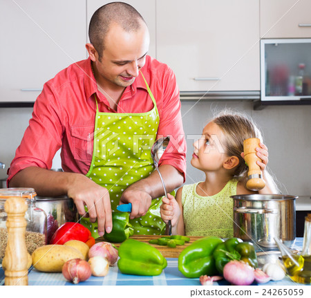 Dad and little daughter cooking 24265059
