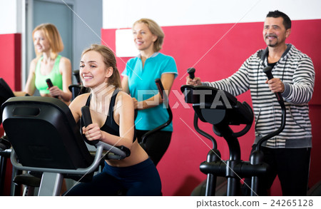 People training on exercise bikes together 24265128
