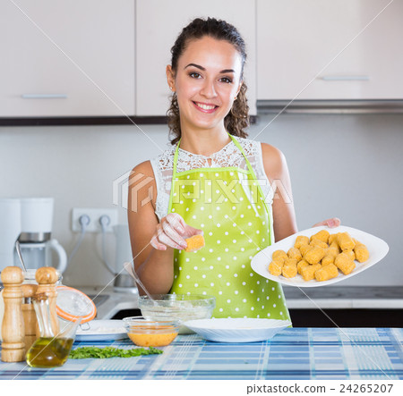 woman rolling filled croquettes woman rolling filled croquettes 24265207