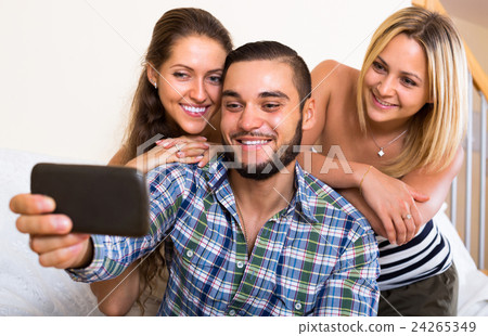 Friends making selfie at home. 24265349