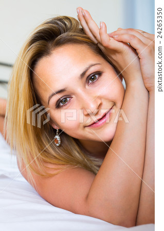 naked woman on bed in bedroom 24265350