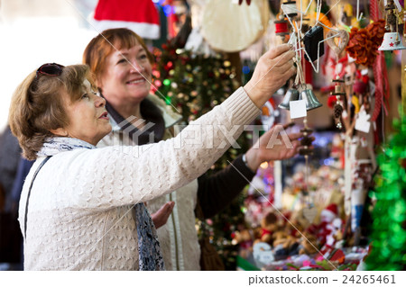 Happy mature women purchasing Christmas decorations Happy mature women purchasing Christmas decorations 24265461