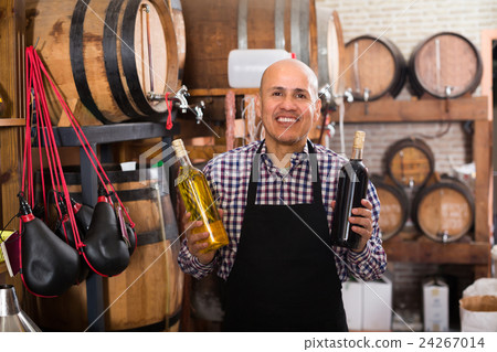 Man with wine in wine house . Man with wine in wine house . 24267014