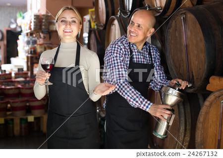 man and woman holding wine vessels man and woman holding wine vessels 24267132
