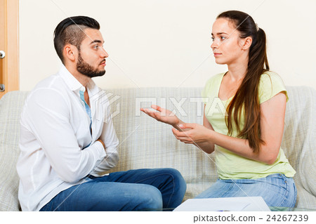 Nervous pair discussing problems Nervous pair discussing problems 24267239